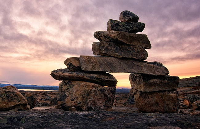 An inukshuk at sunrise